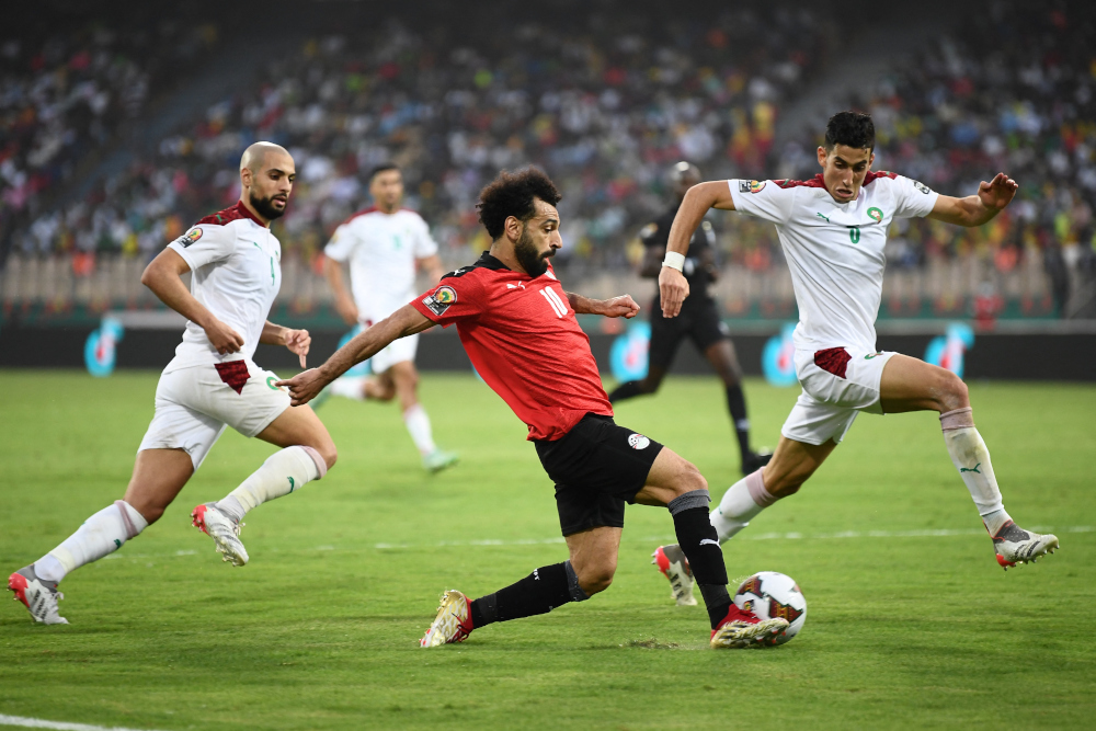 Egyptu00e2u20acu2122s forward Mohamed Salah passes the ball leading to a second team goal during the Africa Cup of Nations 2021 quarter-final football match between Egypt and Morocco at Stade Ahmadou Ahidjo in Yaounde, January 30, 2022. u00e2u20acu201d AFP pic 