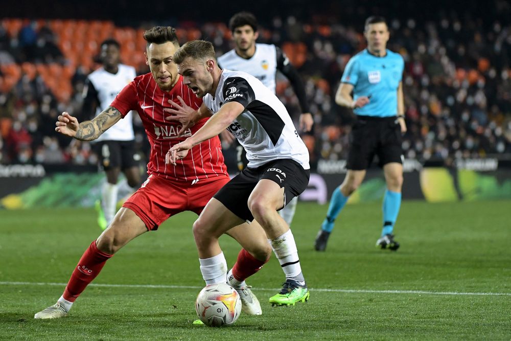 Sevilla midfielder Lucas Ocampos (left) in action against Valencia defender Toni Lato at the Mestalla Stadium in Valencia on January 19, 2022. u00e2u20acu201d AFP picnn