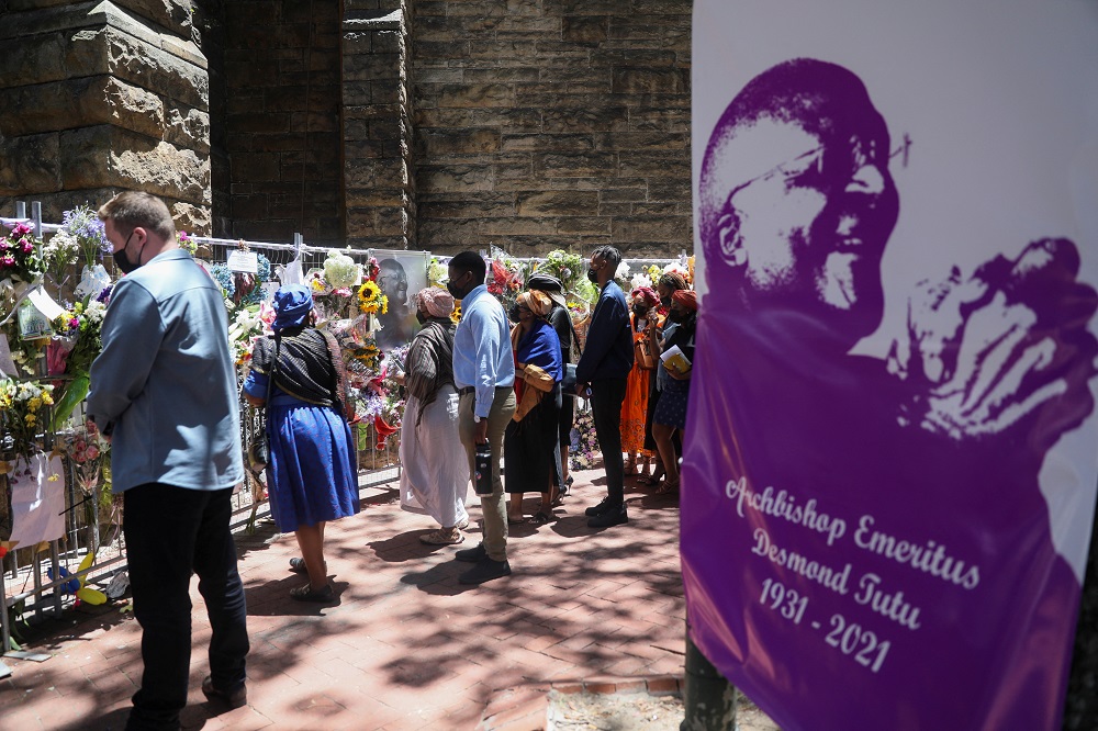 Family members of late Archbishop Desmond Tutu walk past a remembrance wall of flowers and condolence messages left by members of the public, outside the St. Georges Cathedral, in Cape Town, South Africa December 31, 2021. u00e2u20acu2022 Reuters pic
