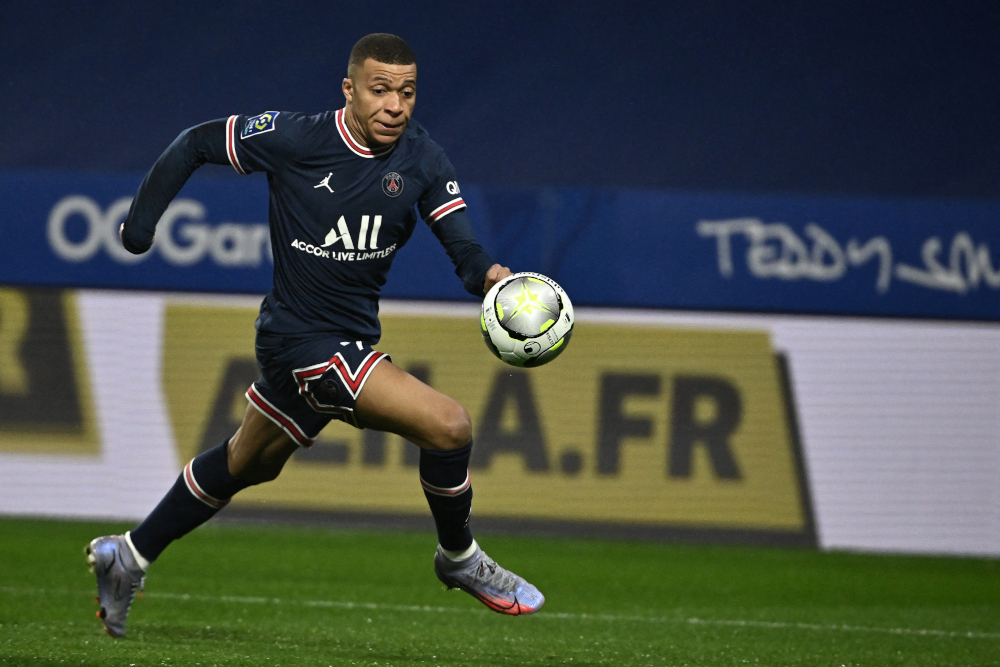 Paris Saint-Germain forward Kylian Mbappe eyes the ball during the French L1 match against Olympique Lyonnais at the Groupama stadium in Decines-Charpieu near Lyon, central eastern France, January 9, 2022. u00e2u20acu201d AFP pic 