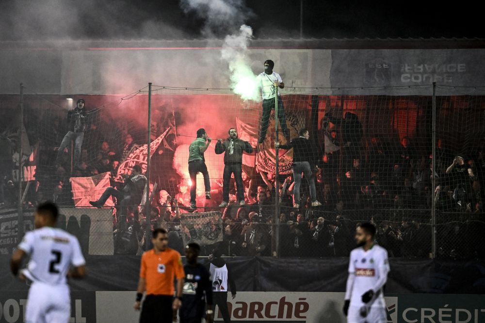 Saint-Etienne's supporters light flares during the French Cup football match against Jura Sud at the Bram Stadium in Louhans January 2, 2022. u00e2u20acu201d AFP pic