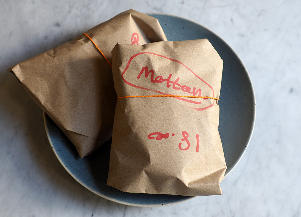 The takeaway is wrapped in a three layer parcel with banana leaf, plastic wrap and brown paper.