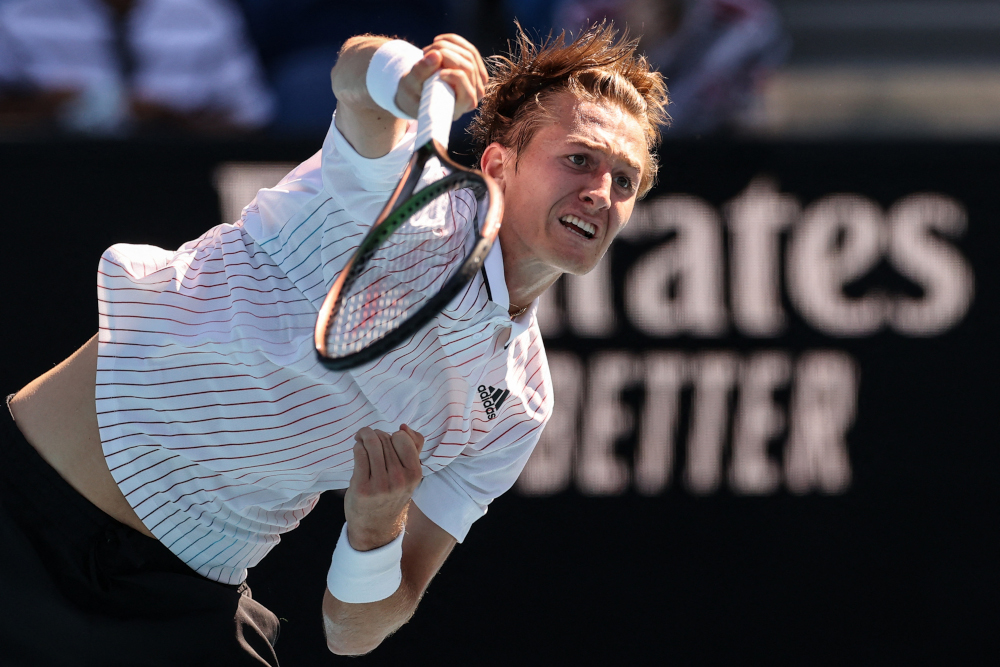 USAu00e2u20acu2122s Sebastian Korda serves against Britainu00e2u20acu2122s Cameron Norrie during their menu00e2u20acu2122s singles match on day one of the Australian Open tennis tournament in Melbourne, January 17, 2022. u00e2u20acu201d AFP pic 