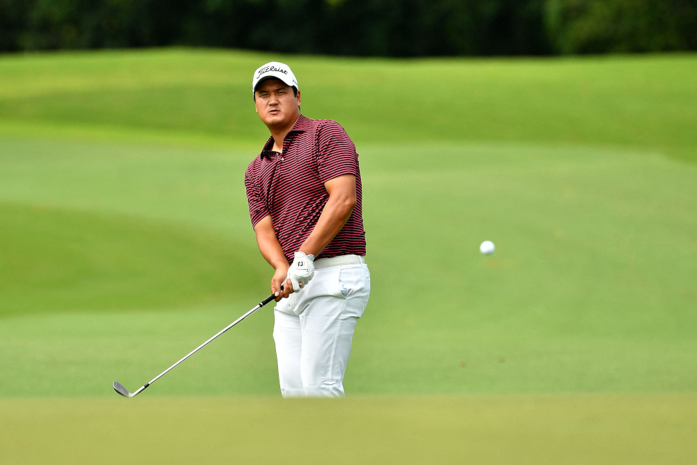 Sihwan Kim of the US hitting a shot during round one of the SMBC Singapore Open golf tournament in Singapore, January 20, 2022. u00e2u20acu201d Paul Lakatos/Sportfive handout pic via AFPnn