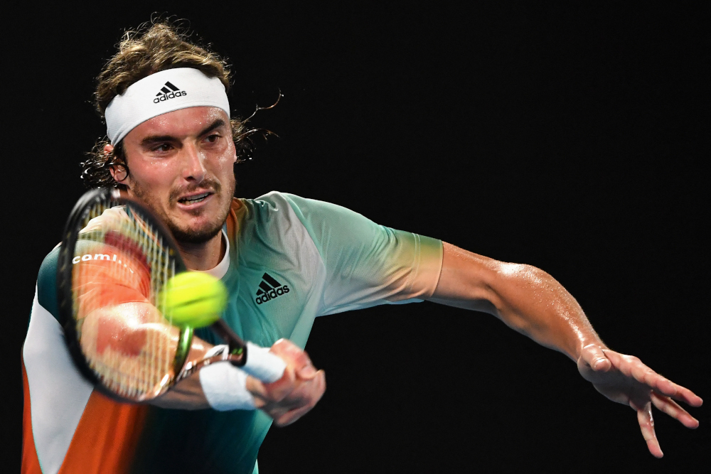 Greeceu00e2u20acu2122s Stefanos Tsitsipas hits a return against Swedenu00e2u20acu2122s Mikael Ymer during their menu00e2u20acu2122s singles match on day two of the Australian Open tennis tournament in Melbourne, January 18, 2022. u00e2u20acu201d AFP picnn