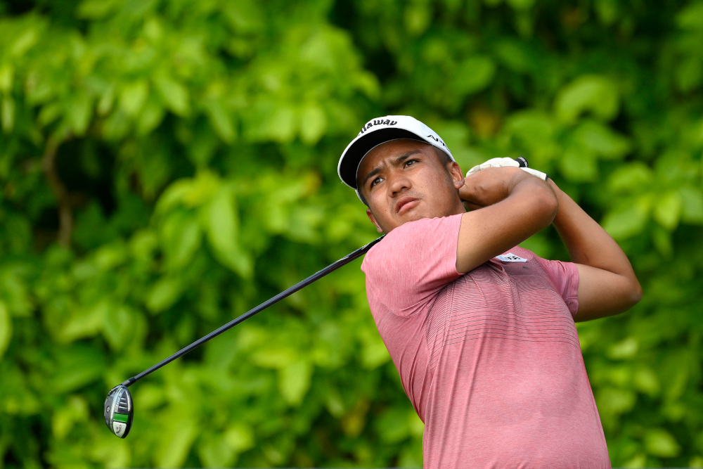 Suradit Yongcharoenchai of Thailand hitting a shot during round one of the SMBC Singapore Open golf tournament in Singapore, January 20, 2022. u00e2u20acu201d Paul Lakatos/Sportfive handout pic via AFPnn
