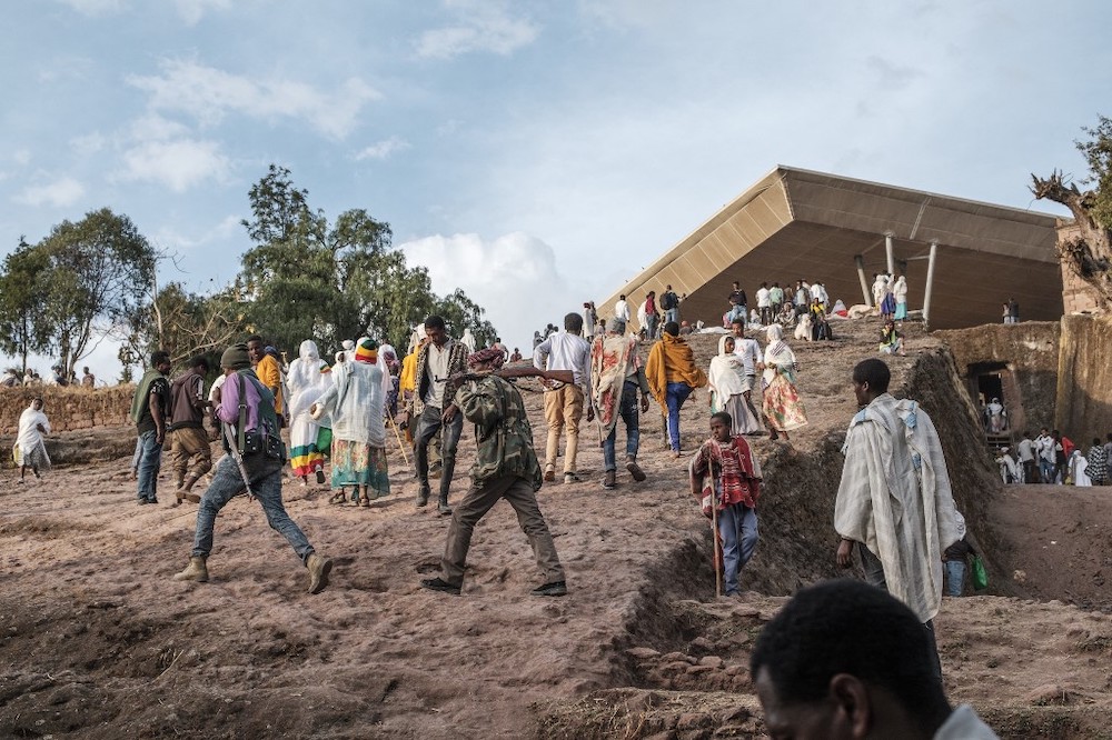 File photo of Amhara militia men walking with their rifles among a crowd of pilgrims during the eve of the celebration of Genna, in the northern Amhara region bordering the northern region of Tigray, on January 6, 2022. u00e2u20acu201d AFP pic