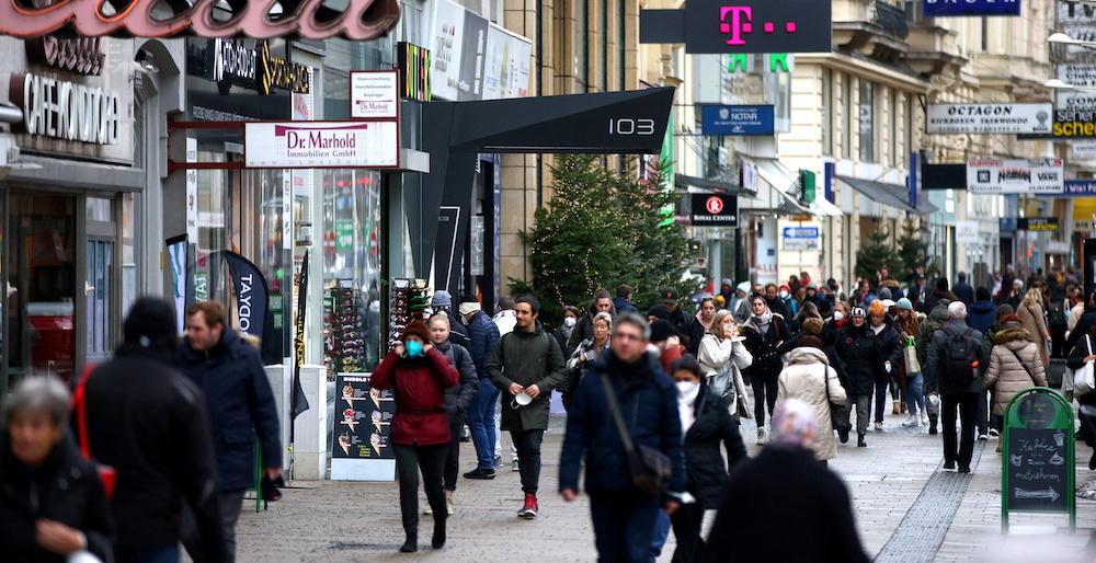 People walk along a shopping street after the fourth full national Covid-19 lockdown was lifted, in Vienna, Austria, December 13, 2021. u00e2u20acu201d Reuters picnn