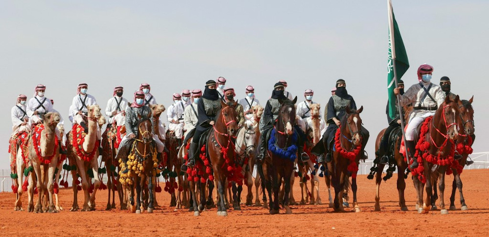 Saudi cameleers and horsewomen take part in a parade during the sixth edition of the King Abdulaziz Camel Festival in the Rumah region, some 161Km east of the capital Riyadh, on January 8, 2022. u00e2u20acu201d AFP pic