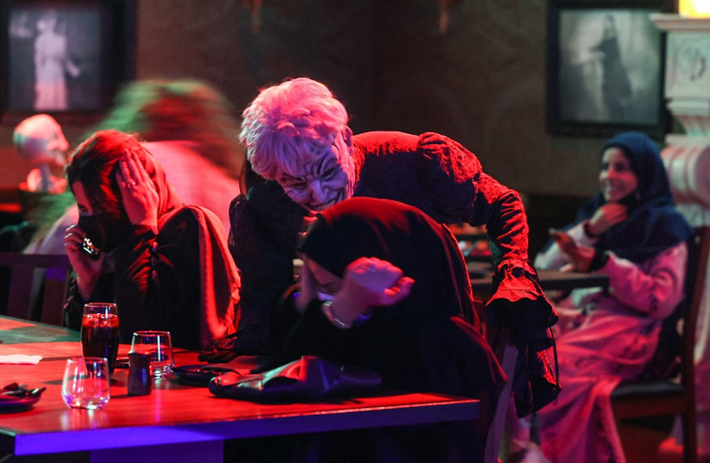 Actors in zombie costumes liven up the atmosphere at the horror-themed u00e2u20acu02dcShadowsu00e2u20acu2122 restaurant in the Saudi capital Riyadhu00e2u20acu2122s Boulevard entertainment city, late on January 19, 2022. u00e2u20acu201d AFP pic