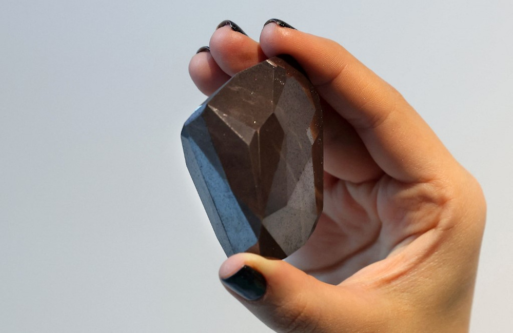 A picture taken on January 17, 2022 shows u00e2u20acu02dcThe Enigmau00e2u20acu2122, a 555.55 carat black diamond, at Sothebyu00e2u20acu2122s in the Gulf emirate of Dubai. u00e2u20acu201d AFP pic