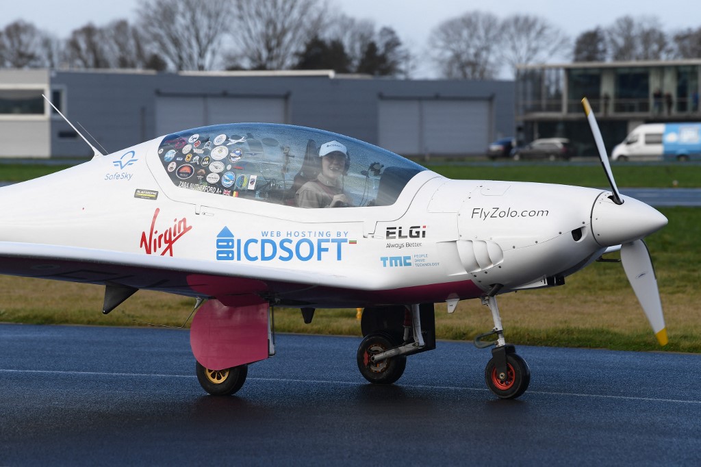 Belgian-British teenage pilot Zara Rutherford, aboard her Shark ultralight, lands back at the end of her solo round-the-world trip in her Belgian hometown of Kortrijk on January 20, 2022. u00e2u20acu201d AFP pic