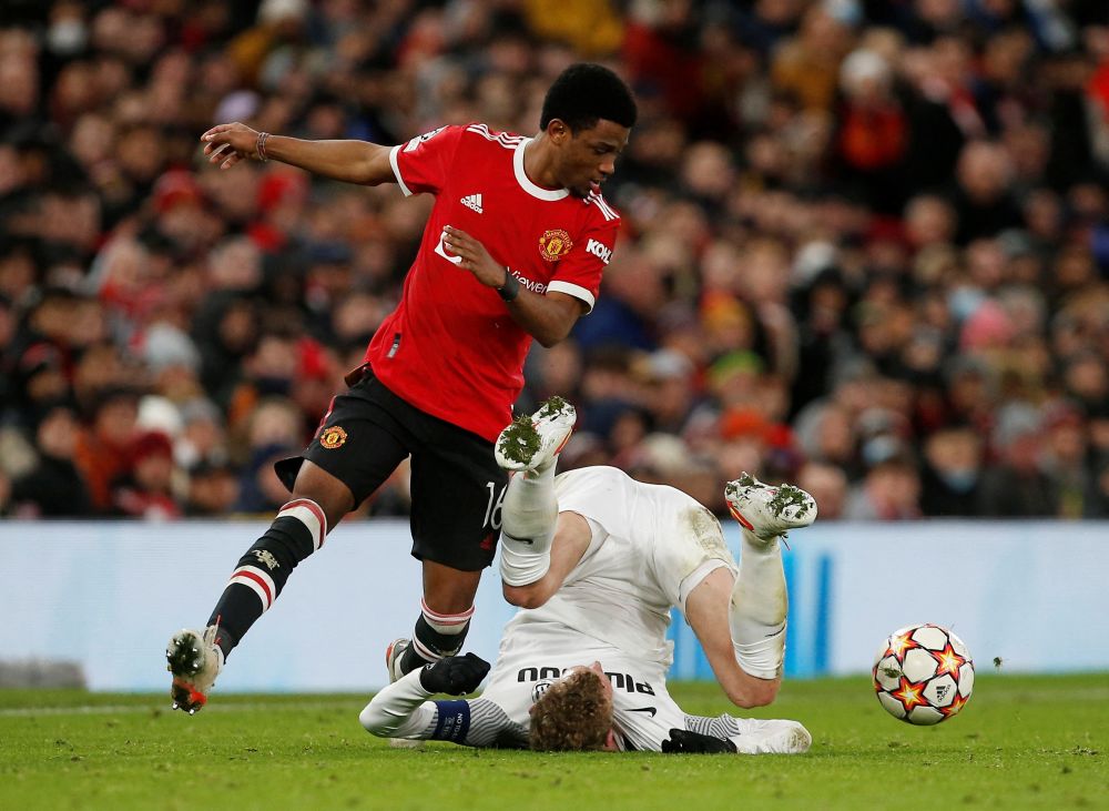 Manchester United's Amad Diallo (left) in action with Young Boys' Fabian Lustenberger at Old Trafford, Manchester December 8, 2021. u00e2u20acu201d Reuters picnn