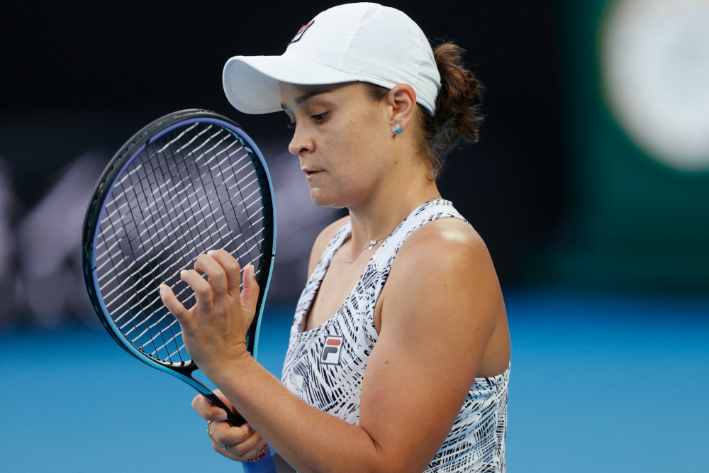 Australiau00e2u20acu2122s Ashleigh Barty checks her racquet as she plays against Ukraineu00e2u20acu2122s Lesia Tsurenko during their womenu00e2u20acu2122s singles match on day one of the Australian Open tennis tournament in Melbourne, January 17, 2022. u00e2u20acu201d AFP pic 