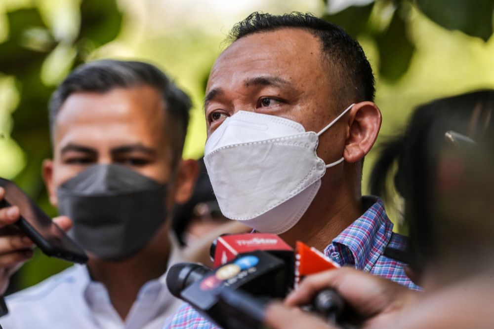 Simpang Renggam MP Maszlee Malik speaks to reporters outside the Dang Wangi district police headquarters in Kuala Lumpur January 7, 2022. u00e2u20acu201d Picture by Hari Anggarann
