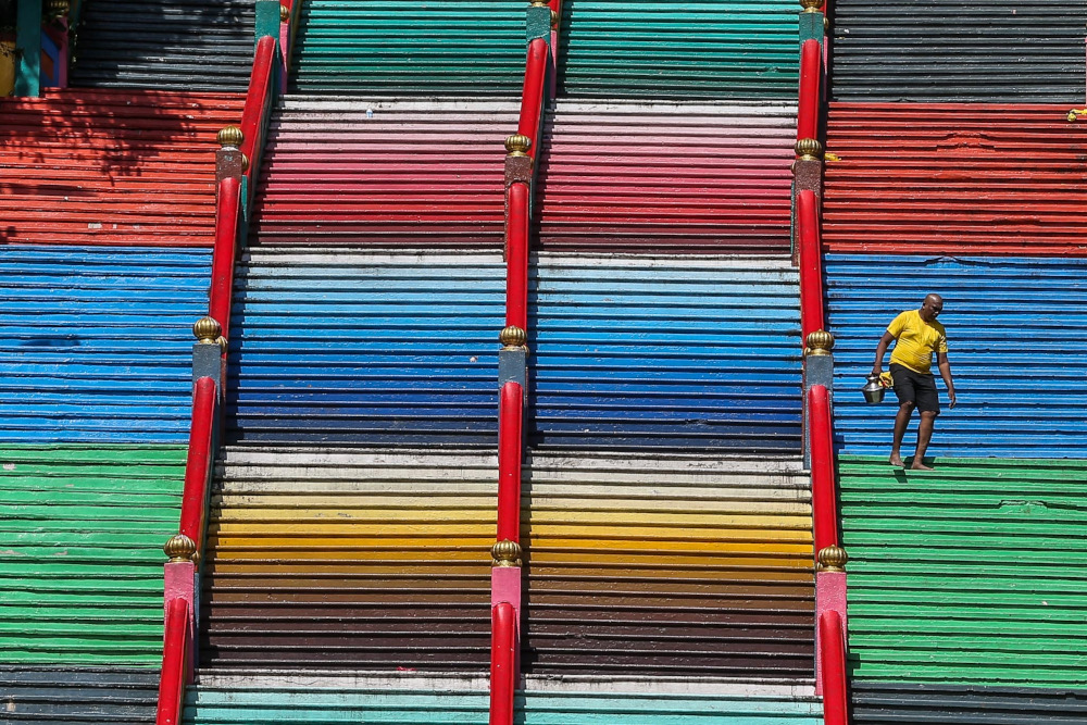 Malaysian Hindu devotees carry milk pots at Batu Caves, January 13, 2022. u00e2u20acu201d Picture by Hari Anggara