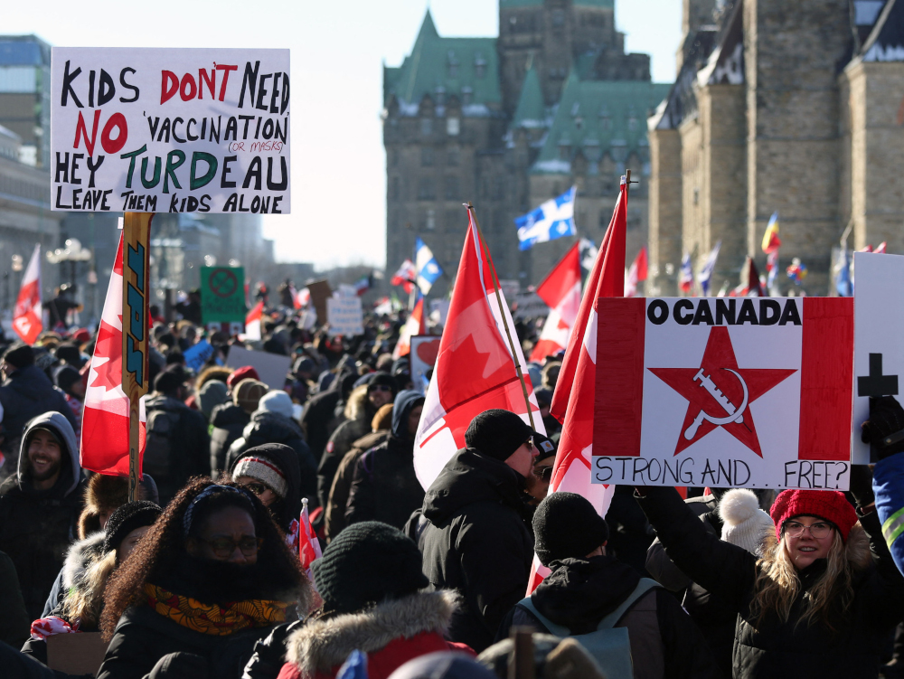 Supporters of the Freedom Convoy protest Covid-19 vaccine mandates and restrictions in front of Parliament, January 29, 2022 in Ottawa, Canada. u00e2u20acu201d AFP picnn
