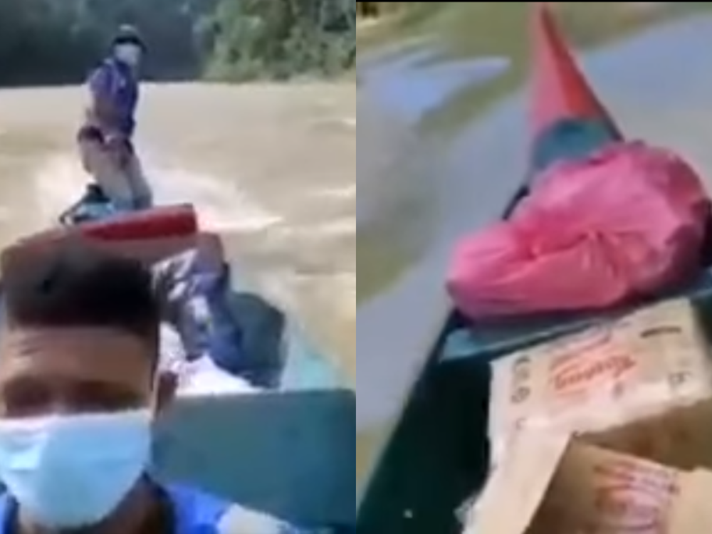 Screenshot showing how three Civil Defence Force officers had to abandon ship after their boat carrying flood relief supplies got overflowed with water. u00e2u20acu201d Facebook screencap 