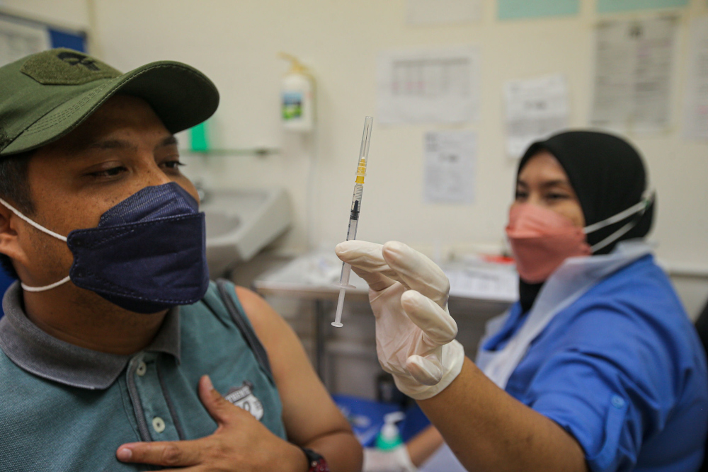 A man receives his Covid-19 booster dose jab at the Perak Community Specialist Hospital (PCSH), January 5, 2022. u00e2u20acu201d Picture by Farhan Najib