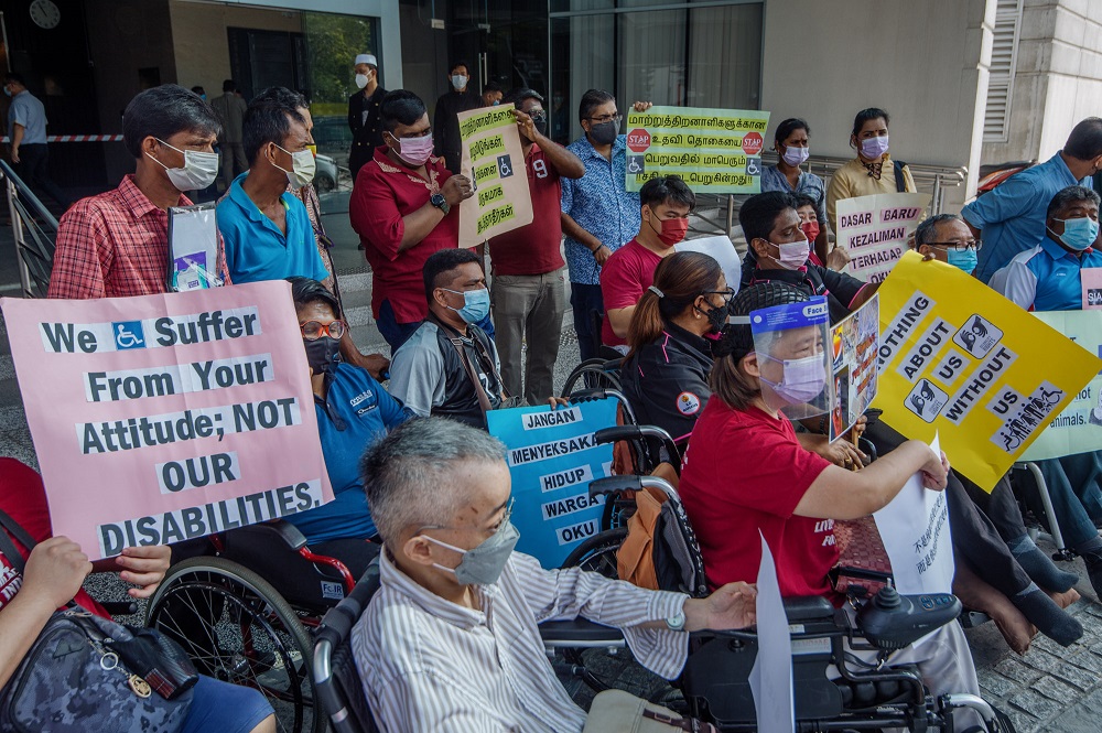 Disability rights groups protest against the 'JKM Cashless Monthly Assistance Payment Cashless Project Without Cash' initiative at the Ministry of Women, Family and Community Development in Putrajaya January 25, 2022. u00e2u20acu2022 Picture by Shafwan Zaidon 