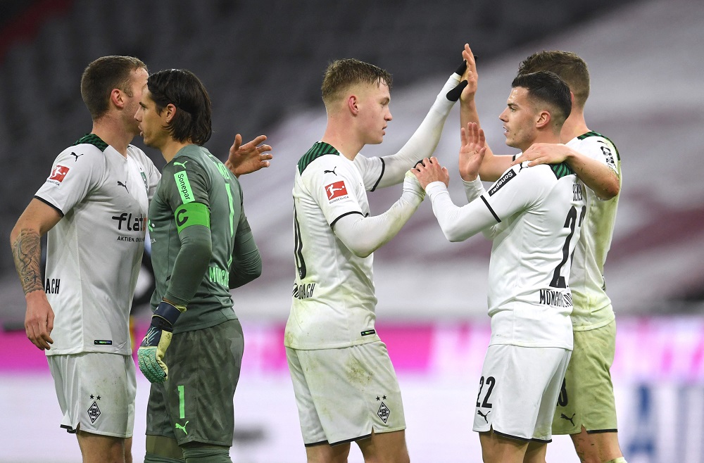 Borussia Moenchengladbach's Laszlo Benes celebrates with teammates after the match against Bayern Munich January 8, 2022. u00e2u20acu2022 Reuters pic