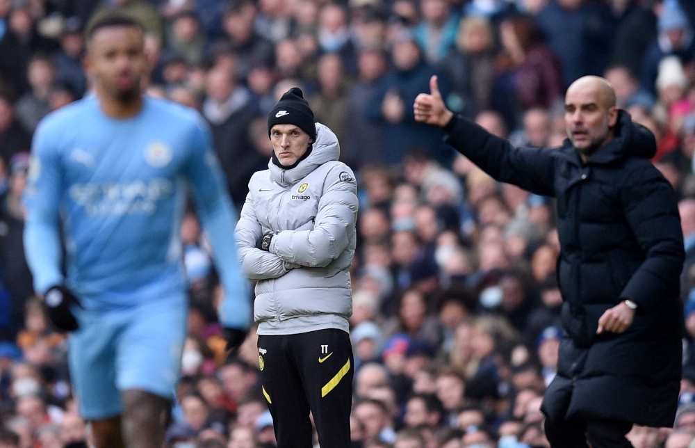 Chelsea head coach Thomas Tuchel reacts as Manchester City manager Pep Guardiola shouts instructions to his players from the touchline during the English Premier League football at the Etihad Stadium in Manchester, January 15, 2022. u00e2u20acu201d AFP pic 