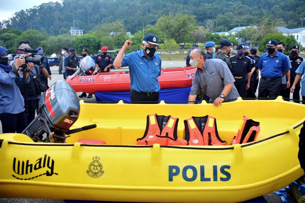 Home Minister Datuk Seri Hamzah Zainudin views boats to be used during flood situations in Kuantan, Pahang, January 17, 2022. u00e2u20acu201d Bernama picnn