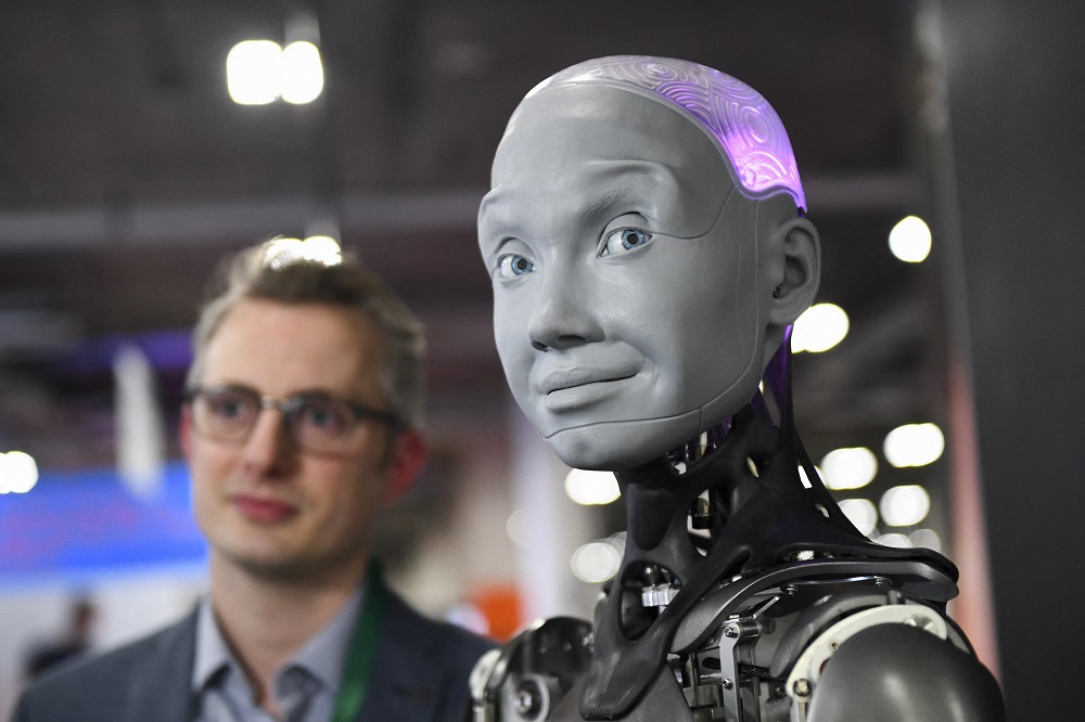 Morgan Roe, director of operations at Engineered Arts, speaks about the Engineered Arts Ameca humanoid robot with artificial intelligence. u00e2u20acu2022 AFP pic