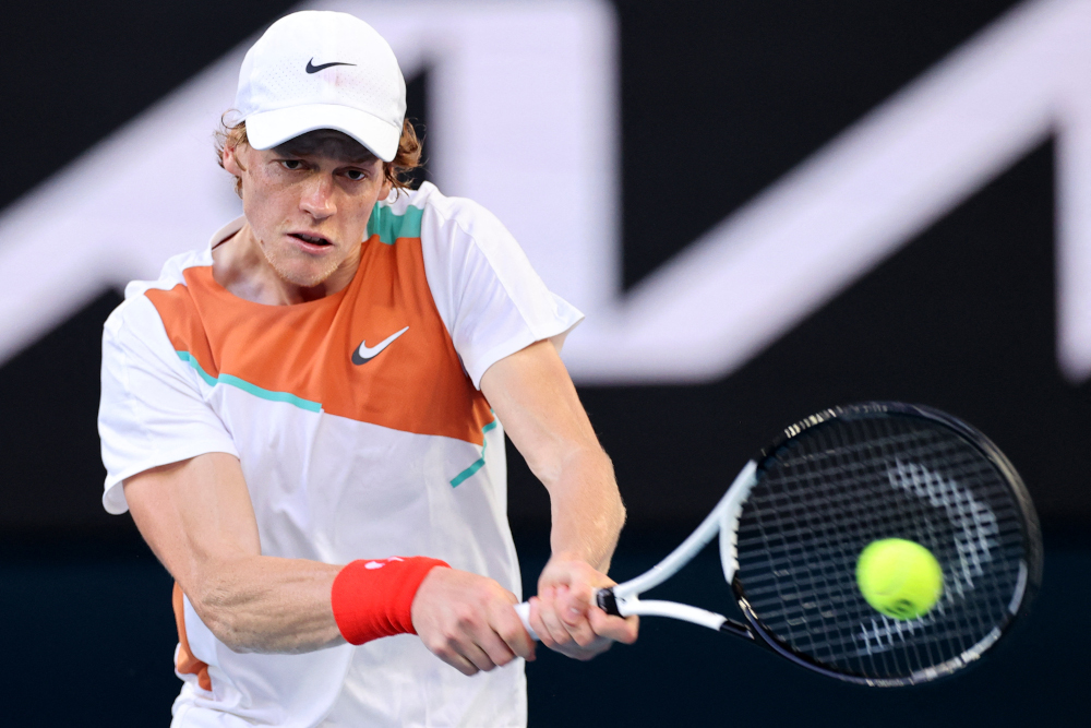 Italyu00e2u20acu2122s Jannik Sinner hits a shot to Australiau00e2u20acu2122s Alex De Minaur during their menu00e2u20acu2122s singles match on day eight of the Australian Open tennis tournament in Melbourne on January 24, 2022. u00e2u20acu201d AFP pic 