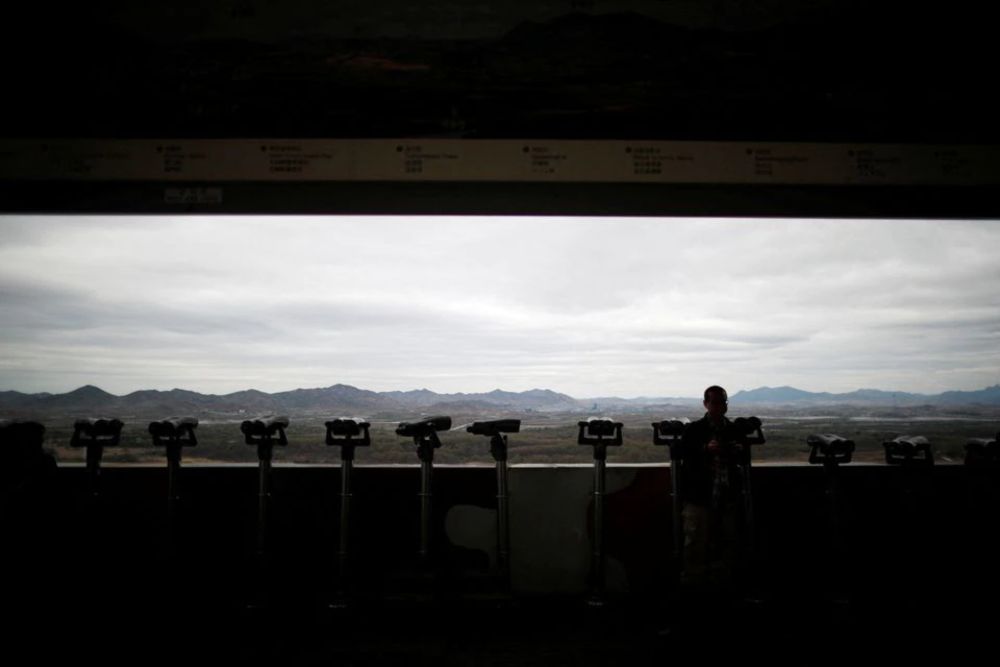 A man stands near binoculars as he tries to see North Koreau00e2u20acu2122s propaganda village of Gijungdong at the Dora observatory near the demilitarised zone separating the two Koreas, in Paju, South Korea, April 24, 2018. u00e2u20acu201d Reuters pic
