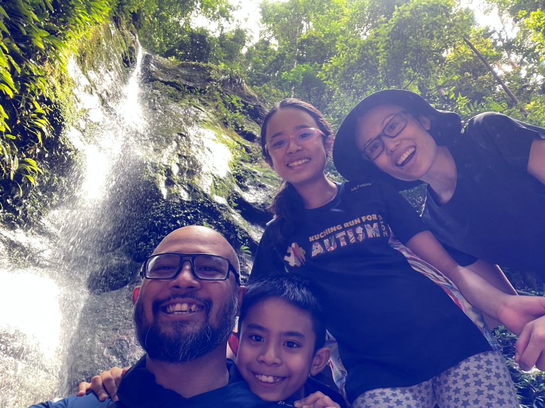 Dr Vong taking a selfie with her family during a hiking trip. u00e2u20acu201d Picture via Borneo Post