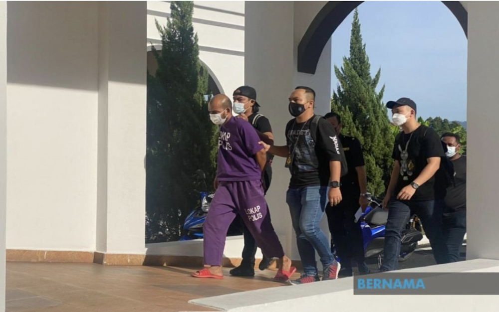 Johor acting police chief Datuk Khaw Kok Chin said Long Tiger, whose real name is Abdul Hamim Ab Hamid, 32, was remanded for investigation under Section 388 of the Penal Code for extortion. u00e2u20acu201d Picture from Twitter/Bernama 