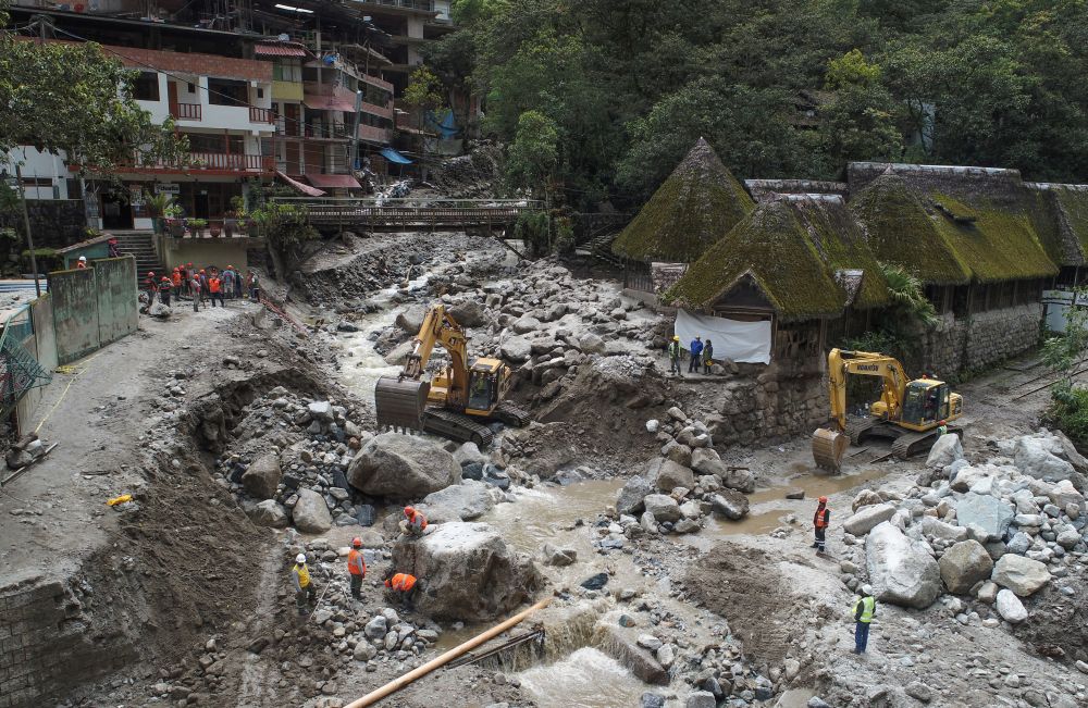 Workers clean up the debris brought by a flash flood caused by season rains at the town of Machu Picchu, Peru, on January 25, 2022. u00e2u20acu201d AFP pic