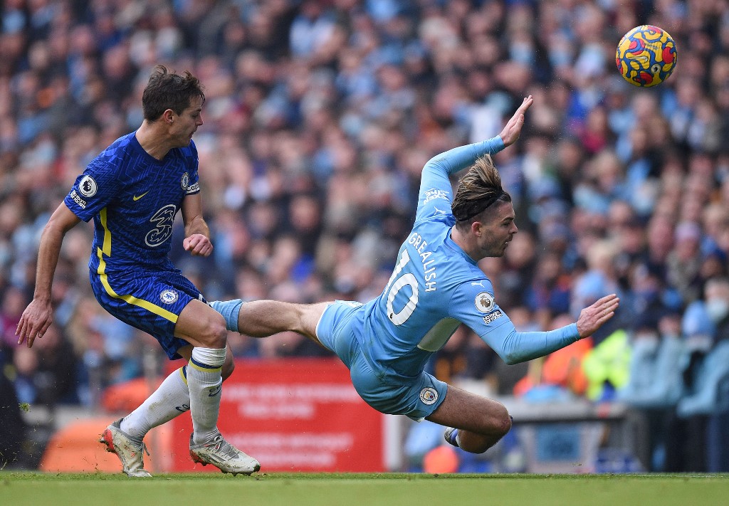 Manchester Cityu00e2u20acu2122s midfielder Jack Grealish (right) falls to the ground after a challenge by Chelseau00e2u20acu2122s defender Cesar Azpilicueta during their Premier League match at the Etihad Stadium in Manchester, on January 15, 2022. u00e2u20acu201d AFP pic
