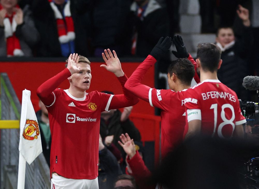 Manchester United's Scott McTominay celebrates scoring their first goal against Aston Villa in the FA Cup with teammates at Old Trafford, Manchester January 10, 2022. u00e2u20acu2022 Reuters 