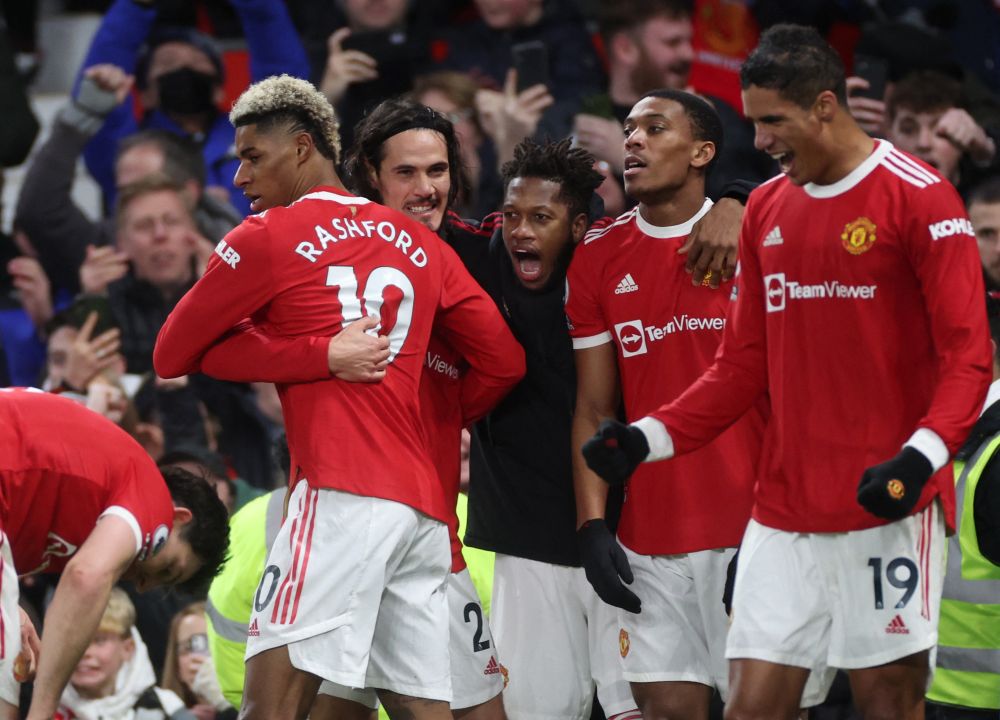 Manchester United's Marcus Rashford celebrates scoring their first goal against West Ham United with Edinson Cavani, Fred, Anthony Martial (second from right) and Raphael Varane at Old Trafford January 22, 2022. u00e2u20acu201d Reuters picn