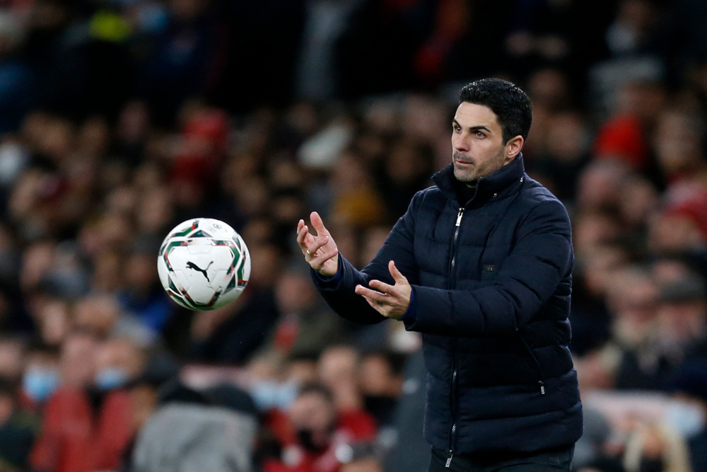 Arsenal manager Mikel Arteta throws the ball onto the pitch during the English League Cup semi-final second leg match between Arsenal and Liverpool at the Emirates Stadium, in London, January 20, 2022. u00e2u20acu201d AFP picnn
