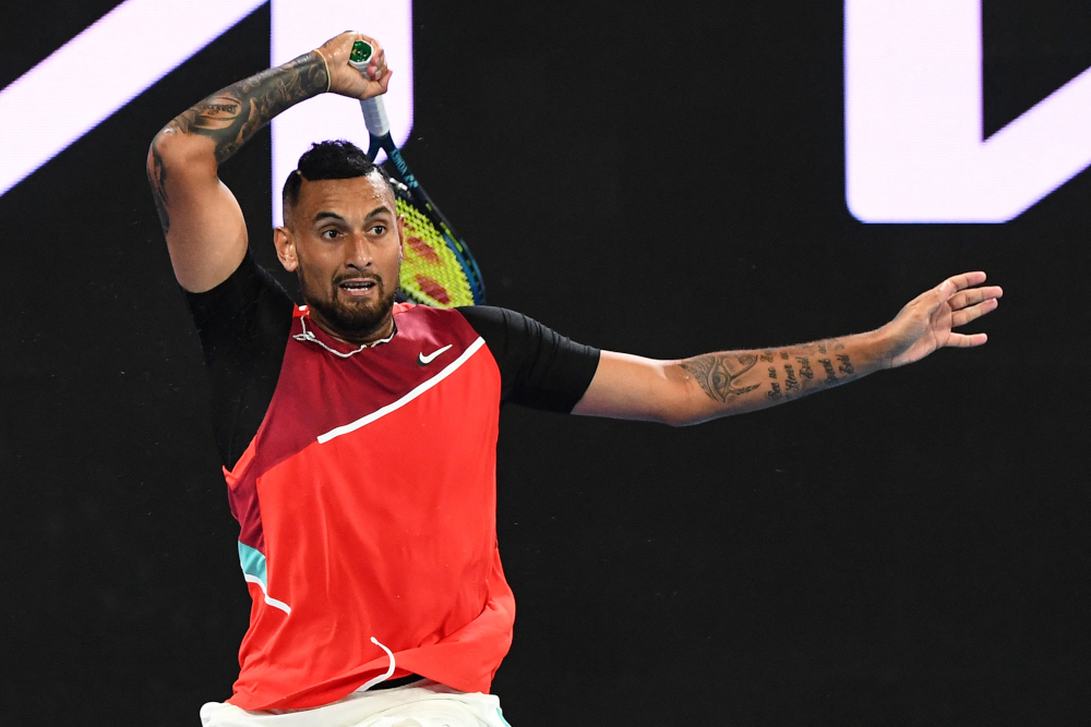 Australiau00e2u20acu2122s Nick Kyrgios hits a return against Britainu00e2u20acu2122s Liam Broady during their menu00e2u20acu2122s singles match on day two of the Australian Open tennis tournament in Melbourne, January 18, 2022. u00e2u20acu201d AFP picnn