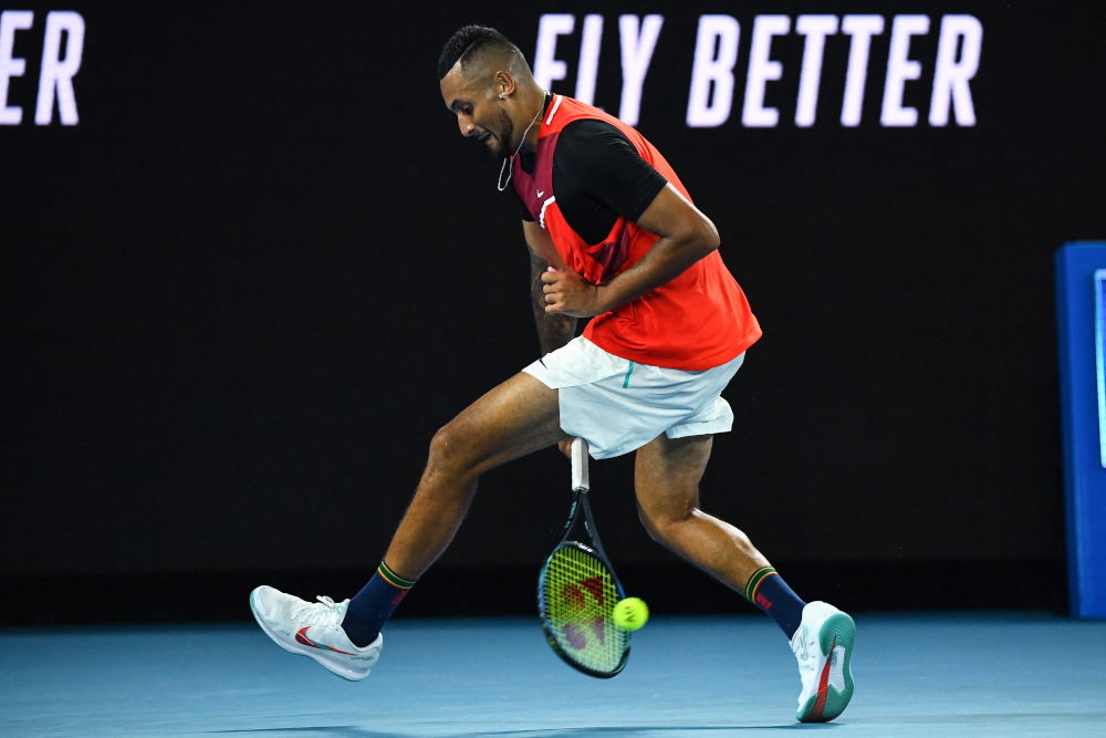 Australiau00e2u20acu2122s Nick Kyrgios hits a return between his legs against Russiau00e2u20acu2122s Daniil Medvedev during their menu00e2u20acu2122s singles match on day four of the Australian Open tennis tournament in Melbourne on January 20, 2022. u00e2u20acu201d AFP pic 