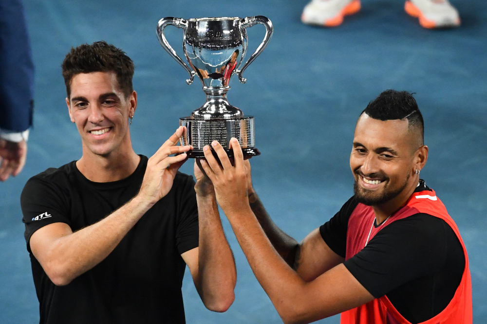 Australiau00e2u20acu2122s Thanasi Kokkinakis (left) and Australiau00e2u20acu2122s Nick Kyrgios pose with the trophy after winning the menu00e2u20acu2122s doubles final match on day thirteen of the Australian Open tennis tournament in Melbourne, January 29, 2022. u00e2u20acu201d AFP pic 