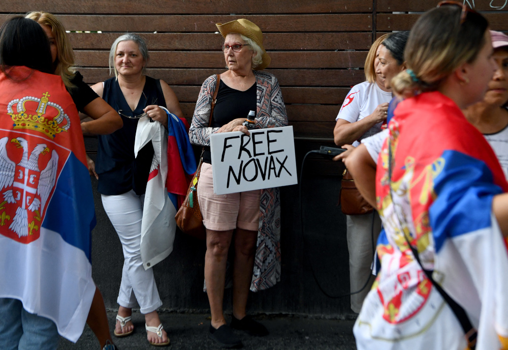 Members of the local Serbian community gather outside a hotel where Serbiau00e2u20acu2122s tennis champion Novak Djokovic is reported to be staying in Melbourne, January 6, 2022. u00e2u20acu201d AFP picnn
