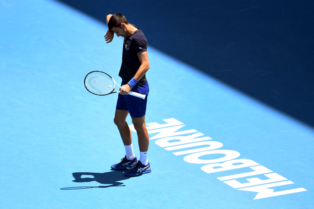 Novak Djokovic of Serbia wipes the sweat from his brow during a practice session ahead of the Australian Open at the Melbourne Park tennis centre in Melbourne, January 12, 2022. u00e2u20acu201d AFP picnn