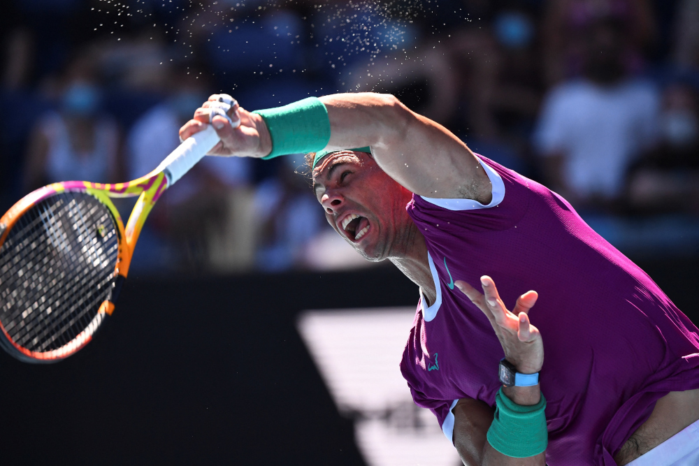 Spainu00e2u20acu2122s Rafael Nadal serves against Canadau00e2u20acu2122s Denis Shapovalov during their menu00e2u20acu2122s singles quarter-final match on day nine of the Australian Open tennis tournament in Melbourne, January 25, 2022. u00e2u20acu201d AFP pic 