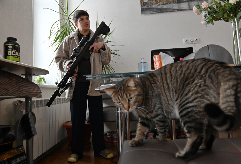 Mariana Jaglo, mother-of-three, holds her Ukrainian Z-15 - Zbroyar long rifle during an interview in the kitchen of her flat in Kiev on January 28, 2022. u00e2u20acu201d AFP pic
