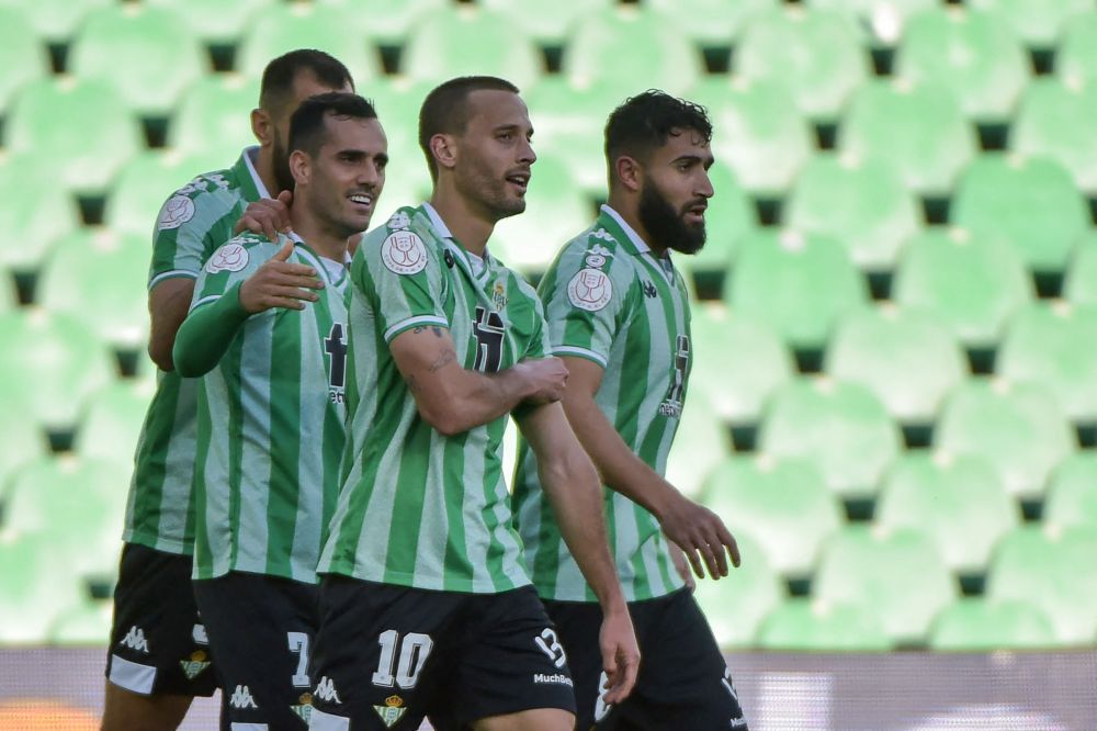 Real Betis midfielder Sergio Canales (centre) celebrates with teammates after scoring a goal during the Spanish Copa del Rey match against Sevilla at the Benito Villamarin Stadium, Seville January 16, 2022. u00e2u20acu201d AFP pic