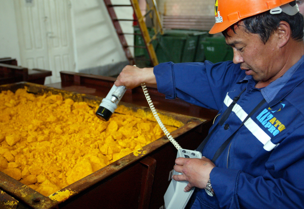 A Kazatomprom worker checks the radiation level of uranium oxide at the East Mynkuduk PV-19 uranium mine in southern Kazakhstan in this file picture taken on May 11, 2006. u00e2u20acu201d Reuters pic
