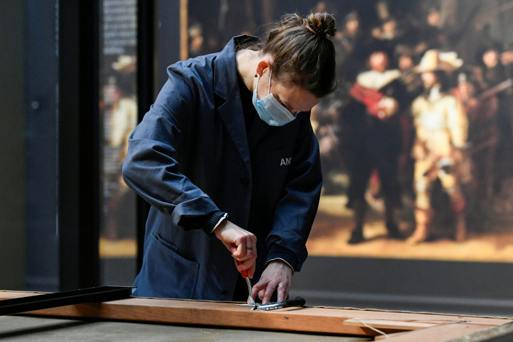 Rembrandtu00e2u20acu2122s painting u00e2u20acu02dcThe Night Watchu00e2u20acu2122 is removed to undergo restoration for the first time in decades, at the Rijksmuseum in Amsterdam January 19, 2022. u00e2u20acu201d Reuters pic