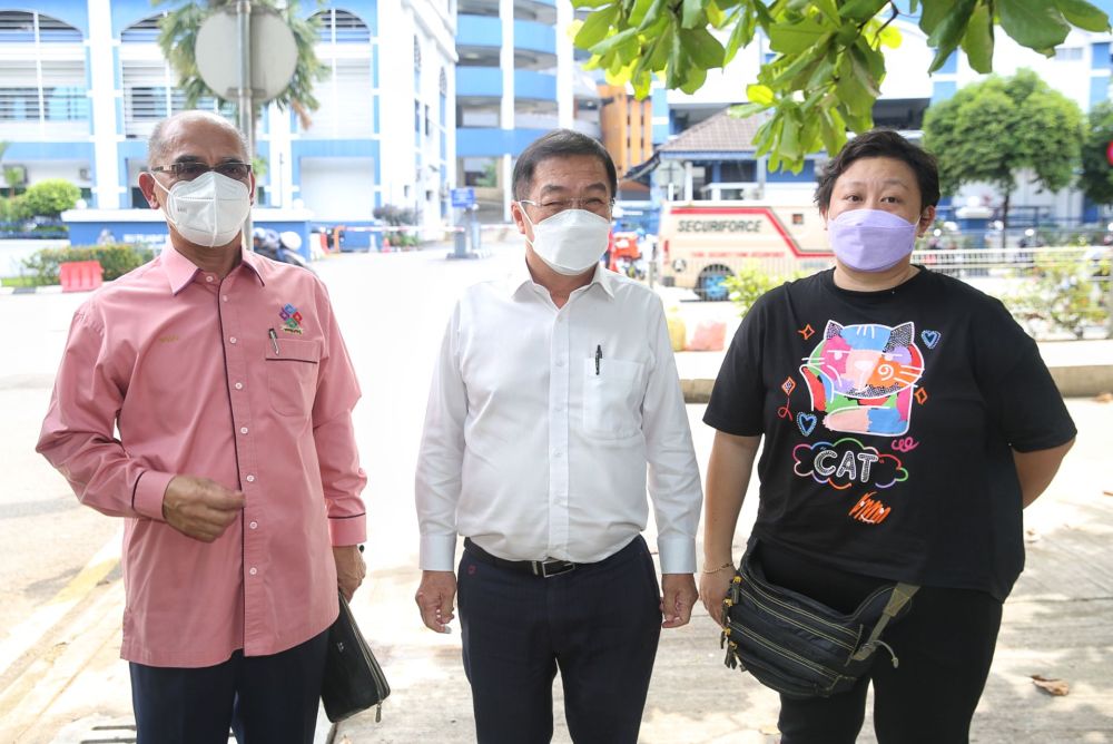 (From left) Datuk Seri Rosli Sulaiman, Cheras MP Tan Kok Wai, and Chai Mei Li are seen in front of the Dang Wangi district police headquarters in Kuala Lumpur January 10, 2022. u00e2u20acu201d Picture by Choo Choy May