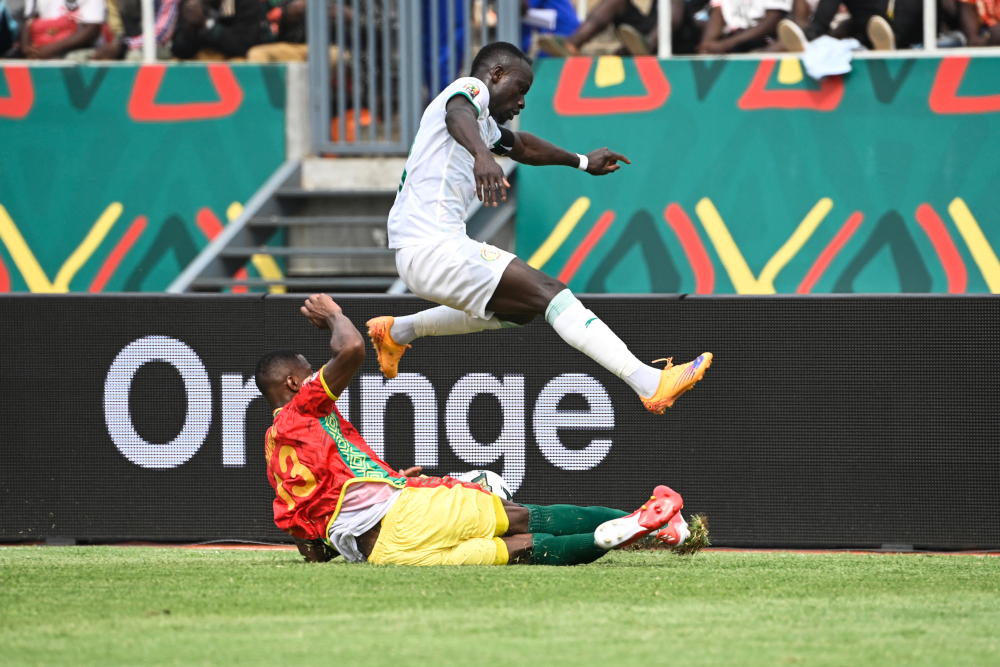 Guineau00e2u20acu2122s defender Issiaga Sylla (down) tackles Senegalu00e2u20acu2122s forward Sadio Mane during the Group B Africa Cup of Nations 2021 match between Senegal and Guinea at Stade de Kouekong in Bafoussam, January 14, 2022. u00e2u20acu201d AFP pic 