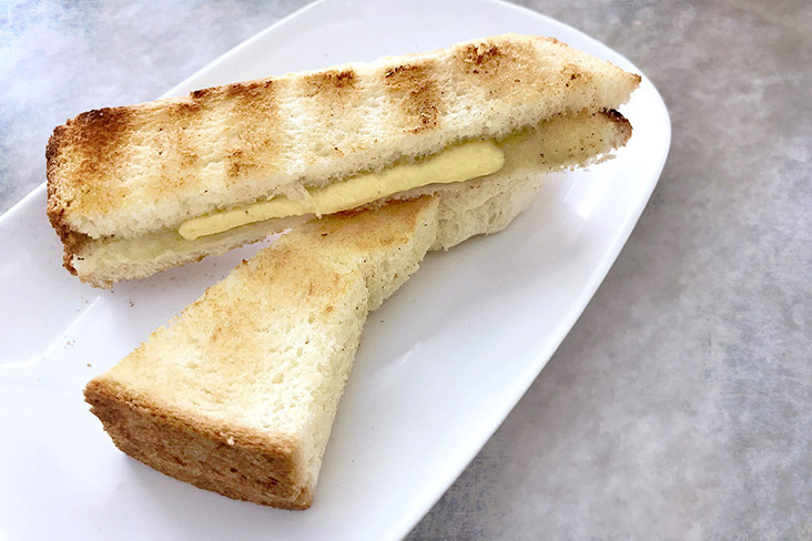 Butter 'kaya' toast, with the butter generously applied.